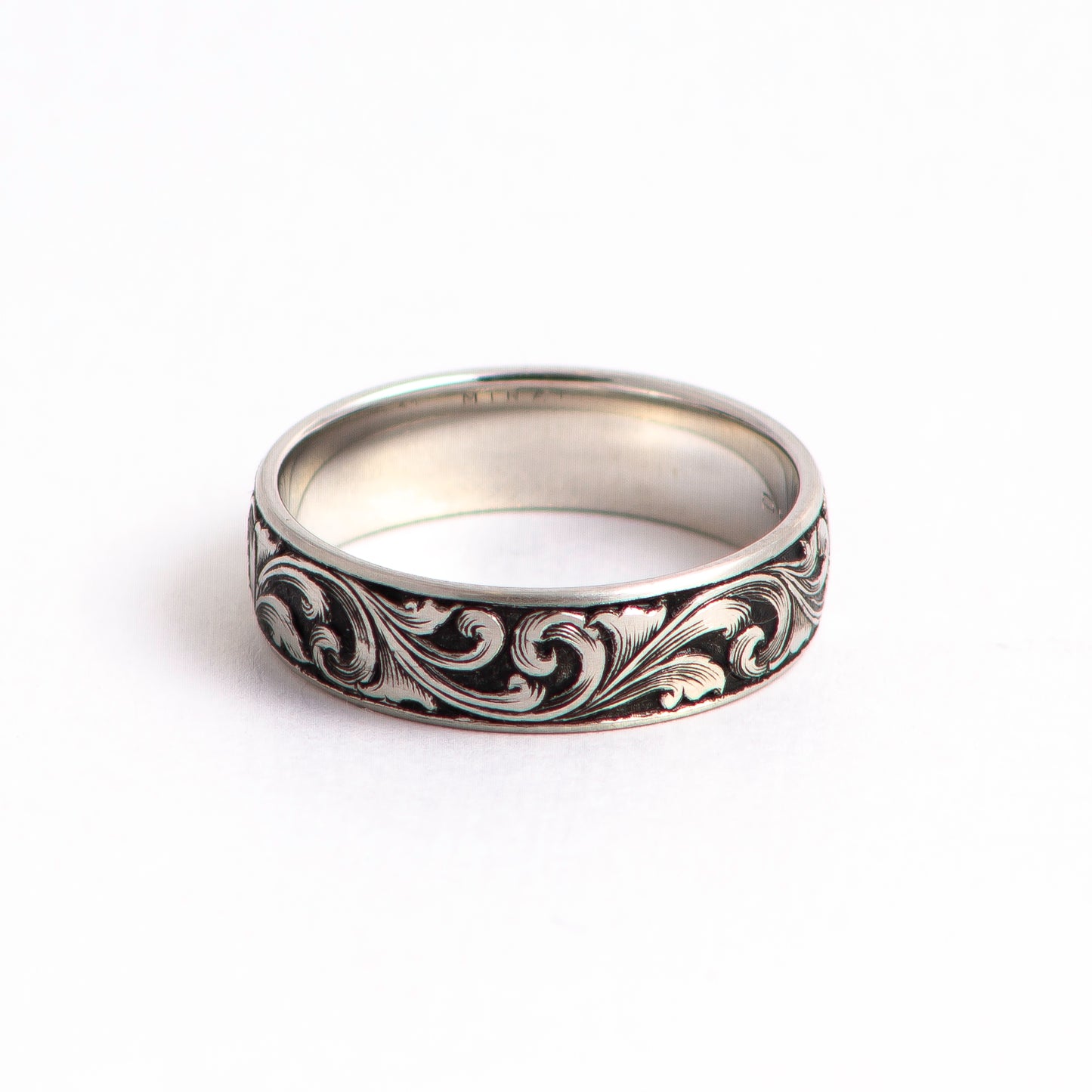 Hand Engraved Platinum Ring with deep relief scrollwork